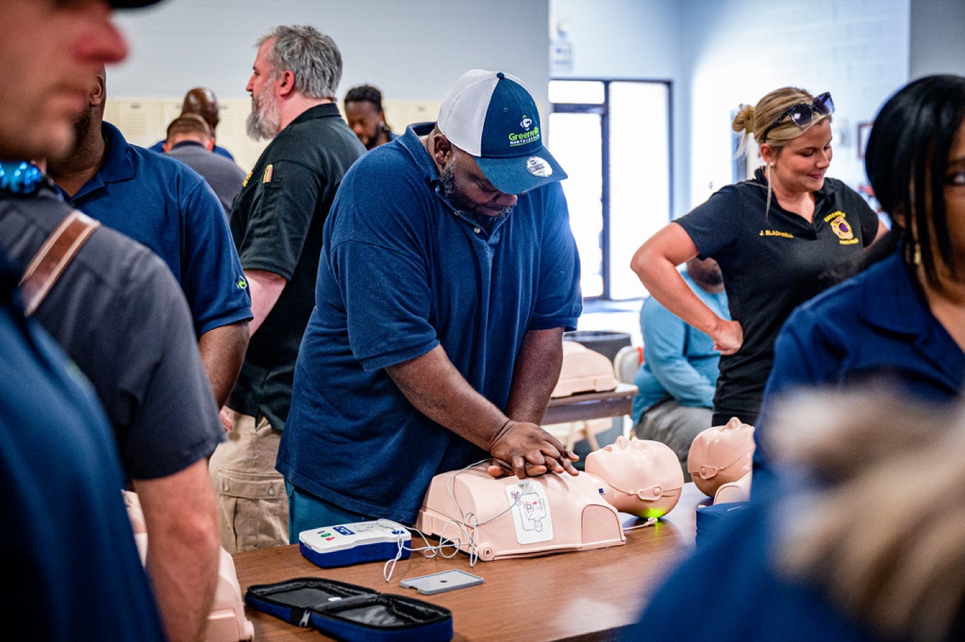 First aid trainer leading a group class